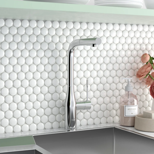 GROHE Essence single-lever kitchen tap with high L-shaped spout. A German engineered sink mixer with 360° swivel range and pull-out comfort shower he